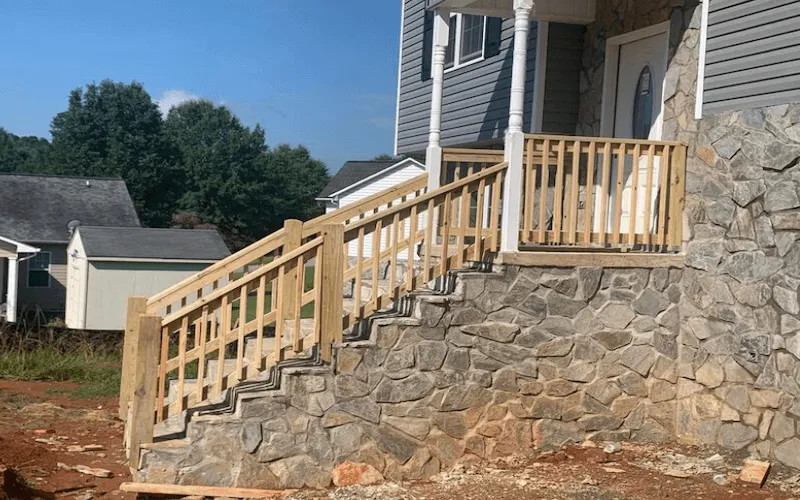 new-wood-stairs-and-railings-over-stone-steps